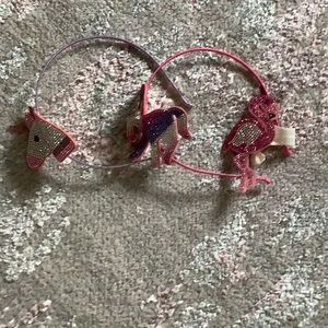 A set of three to unicorn headband and flamingo hair tie